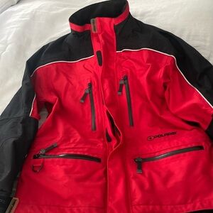Woman’s Polaris ski/snowmobile jacket.  Red and black with gray detail.